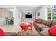 Bright living room featuring a built-in entertainment center and comfortable floral sofa at 528 45Th St, Sarasota, FL 34234