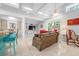 Spacious living room featuring a built-in entertainment center, bright windows, and comfortable seating at 528 45Th St, Sarasota, FL 34234