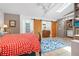 Spacious bedroom featuring a barn door, vanity and ample natural light from a skylight at 528 45Th St, Sarasota, FL 34234