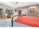 Well lit primary bedroom with ceiling fan, skylight, stylish decor, and an open layout at 528 45Th St, Sarasota, FL 34234