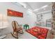 Bright office space with a large area rug, rocking chair, and a dedicated workstation at 528 45Th St, Sarasota, FL 34234