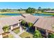 Aerial view featuring the community, a tranquil lake, and a well-maintained condo at 6209 Heritage Ln # 6209, Bradenton, FL 34209
