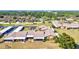 Expansive view of community homes, carports, and meticulously maintained grounds with mature trees at 6209 Heritage Ln # 6209, Bradenton, FL 34209