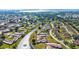An aerial view shows homes nestled in a lush community surrounded by mature trees and calming waters at 6209 Heritage Ln # 6209, Bradenton, FL 34209