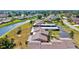 High-angle shot of community featuring residential buildings, carports, and a winding canal at 6209 Heritage Ln # 6209, Bradenton, FL 34209