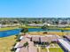 Aerial view of residences and serene lake, showcasing a well-planned community with beautiful surroundings at 6209 Heritage Ln # 6209, Bradenton, FL 34209