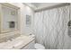 Bathroom featuring a white shower curtain, neutral sink, and decorative mirror at 6209 Heritage Ln # 6209, Bradenton, FL 34209