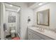 Bathroom featuring a shower with glass doors, vanity, and neutral decor at 6209 Heritage Ln # 6209, Bradenton, FL 34209