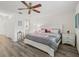 Bedroom featuring a queen-size bed, modern decor, and en-suite access to a half bathroom at 6209 Heritage Ln # 6209, Bradenton, FL 34209