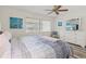 Bedroom with a queen-size bed, modern decor, and plenty of natural light from a large window at 6209 Heritage Ln # 6209, Bradenton, FL 34209
