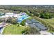 Aerial view of the community recreational area, with a swimming pool, tennis courts, and playground at 6209 Heritage Ln # 6209, Bradenton, FL 34209