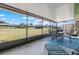 Enclosed patio area with outdoor seating and scenic backyard views at 6209 Heritage Ln # 6209, Bradenton, FL 34209