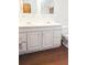 Bathroom featuring a double vanity with framed mirrors and storage at 624 19Th W St, Bradenton, FL 34205