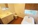 Classic bathroom with a clawfoot tub, vintage-style fixtures, and a window with natural light at 624 19Th W St, Bradenton, FL 34205