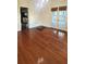 Dining room with hardwood floors, chandelier and glass panel door at 624 19Th W St, Bradenton, FL 34205