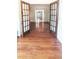 Spacious entryway with hardwood floors, decorative french doors, and lots of natural light at 624 19Th W St, Bradenton, FL 34205