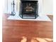 Close-up of a classic fireplace with a decorative screen and tiled hearth at 624 19Th W St, Bradenton, FL 34205