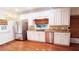 Bright kitchen with stainless steel appliances, granite countertops and ample cabinet space at 624 19Th W St, Bradenton, FL 34205
