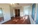 Spacious living room with hardwood floors, bright natural light, and classic architectural details at 624 19Th W St, Bradenton, FL 34205