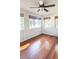 Cozy living room featuring a ceiling fan and natural light from multiple windows at 624 19Th W St, Bradenton, FL 34205