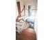 Staircase with wood treads, white risers and a wooden handrail offers a view of the home's interior at 624 19Th W St, Bradenton, FL 34205