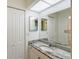 Bright bathroom with granite vanity, mirror, and linen closet at 6240 7Th W Ave # 6240, Bradenton, FL 34209