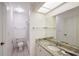 Bright bathroom with granite vanity, mirror, and tiled shower-tub combo at 6240 7Th W Ave # 6240, Bradenton, FL 34209