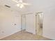 Bright bedroom with a ceiling fan, tile floors, closet and an ensuite bathroom at 6240 7Th W Ave # 6240, Bradenton, FL 34209