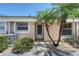 Welcoming front entrance with a well-kept garden, featuring palm trees adding a touch of tropical charm at 6240 7Th W Ave # 6240, Bradenton, FL 34209