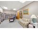 Community library with large bookshelf and floral pattern couch at 6240 7Th W Ave # 6240, Bradenton, FL 34209