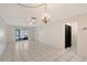 Spacious living room with neutral tile flooring, a ceiling fan, and ample natural light, ready for personalization at 6240 7Th W Ave # 6240, Bradenton, FL 34209