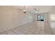 Bright living room featuring tile flooring and a sliding door, offering a seamless transition to outdoor living at 6240 7Th W Ave # 6240, Bradenton, FL 34209