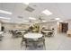 Spacious meeting room with tables, chairs, and ceiling fans at 6240 7Th W Ave # 6240, Bradenton, FL 34209