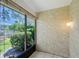 Enclosed patio with natural light and view of lush outdoor landscaping, creating a relaxing ambiance at 6240 7Th W Ave # 6240, Bradenton, FL 34209