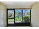Relaxing screened patio view with a serene garden, perfect for enjoying the outdoors in comfort and privacy at 6240 7Th W Ave # 6240, Bradenton, FL 34209