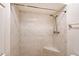 Walk-in shower features white subway tile and a corner seat at 6240 7Th W Ave # 6240, Bradenton, FL 34209
