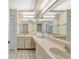 Bright bathroom with a double vanity and ample counter space and a large mirror at 6415 39Th W Ave, Bradenton, FL 34209