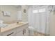 Cozy bathroom with a toilet and shower with a curtain at 6415 39Th W Ave, Bradenton, FL 34209