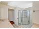 Bathroom featuring a glass-enclosed shower and tile flooring at 6415 39Th W Ave, Bradenton, FL 34209