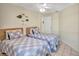 Comfortable bedroom with two twin beds and coastal decorations at 6415 39Th W Ave, Bradenton, FL 34209
