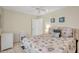 Cozy bedroom with a seashell-themed bedspread and coastal-inspired decor at 6415 39Th W Ave, Bradenton, FL 34209