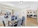 Bright dining area with modern table and chairs open to the kitchen and living room at 6415 39Th W Ave, Bradenton, FL 34209