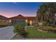 Inviting single Gathering home with a lovely landscaped front yard and tile roof at 6415 39Th W Ave, Bradenton, FL 34209