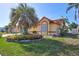 Beautiful home featuring manicured landscaping, a mature palm tree, and great curb appeal at 6415 39Th W Ave, Bradenton, FL 34209