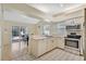 Bright kitchen with stainless steel appliances and neutral countertops at 6415 39Th W Ave, Bradenton, FL 34209