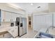 Well-lit kitchen featuring stainless steel refrigerator and ample cabinet space at 6415 39Th W Ave, Bradenton, FL 34209