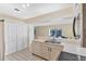 Bright kitchen featuring white cabinetry and a breakfast bar at 6415 39Th W Ave, Bradenton, FL 34209