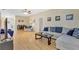 Bright living room with hardwood floors, neutral décor, and comfortable seating at 6415 39Th W Ave, Bradenton, FL 34209