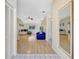 Bright living room with tile entry and wood flooring flowing into the living space at 6415 39Th W Ave, Bradenton, FL 34209
