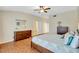 Large main bedroom with ceiling fan, dressers, and ensuite bath access at 6415 39Th W Ave, Bradenton, FL 34209